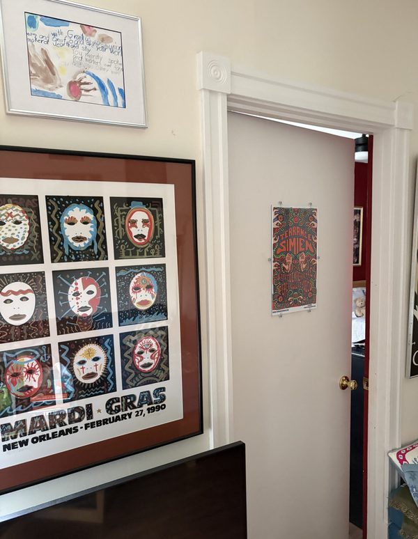 Hallway gallery wall of local artwork